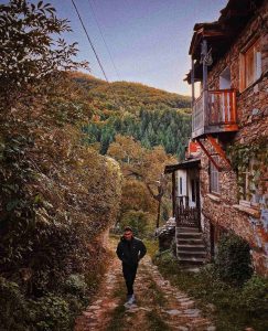 Chris Zahariev on a stroll in Kosovo village